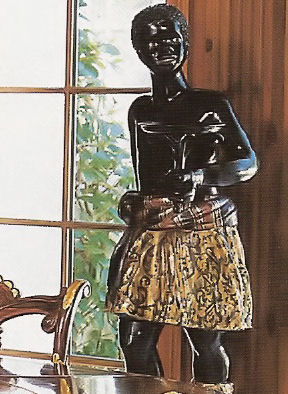Statue of a black slave with serving tray